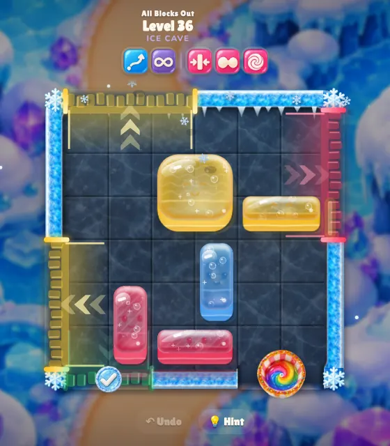 An All Blocks Out level in the Ice Cave with a rainbow mixing bowl in the corner of the board